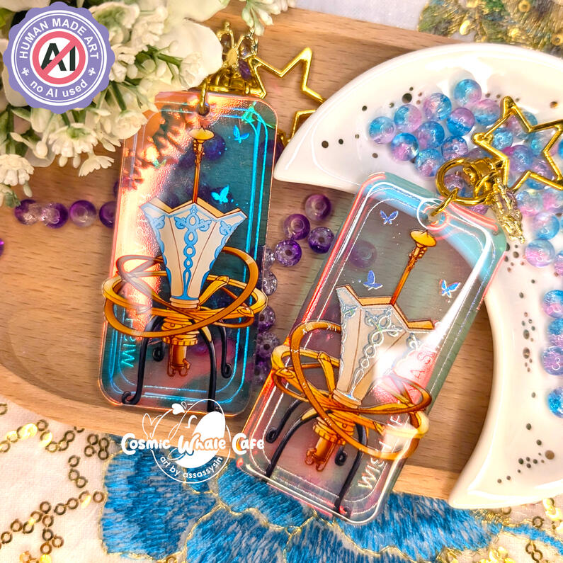 rainbow acrylic charm featuring a star gazer from the videogame Lies of p